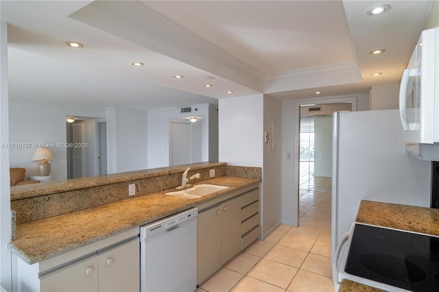 4000 Towerside Ter Unit 908, Miami, FL 33138 - kitchen with light tile patterned floors, white appliances, a raised ceiling, ornamental molding, and recessed lighting