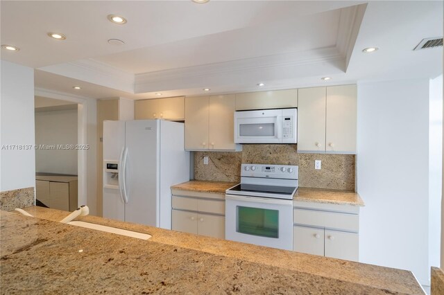 4000 Towerside Ter Unit 908, Miami, FL 33138 - kitchen featuring a tray ceiling, crown molding, white appliances, tasteful backsplash, and recessed lighting
