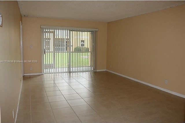 view of tiled spare room