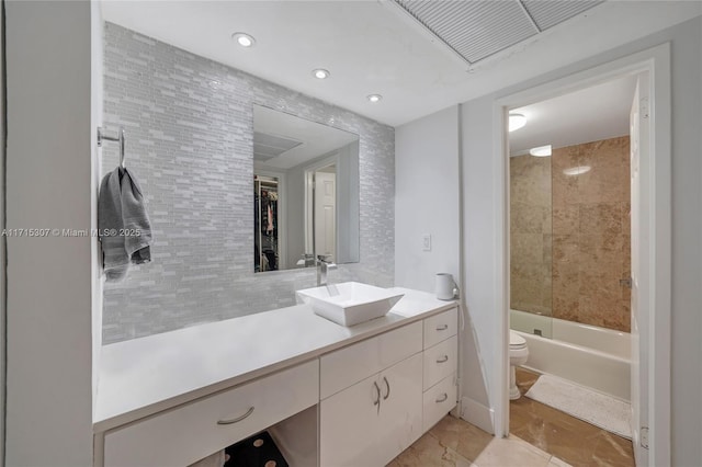 bathroom with recessed lighting, vanity, toilet, visible vents, and shower / washtub combination