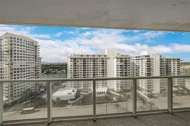 balcony featuring a water view