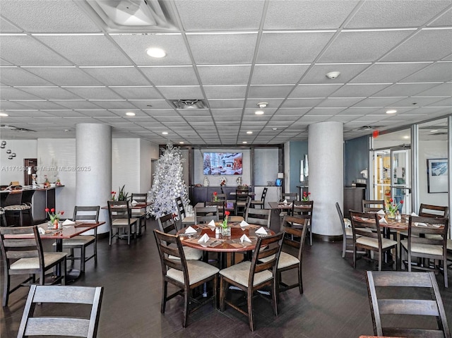 dining space featuring a paneled ceiling