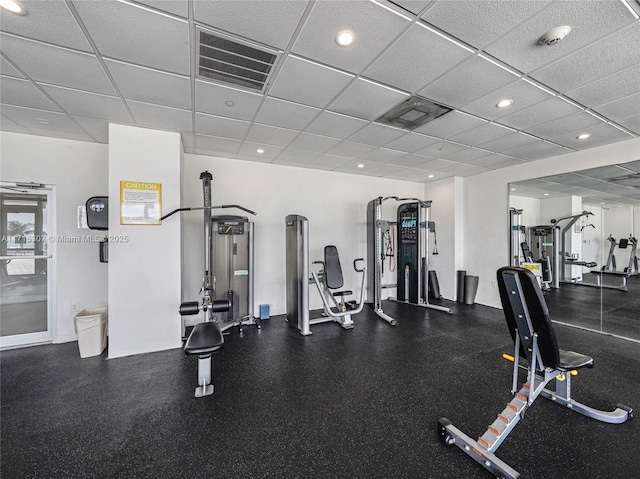 gym featuring visible vents and a drop ceiling