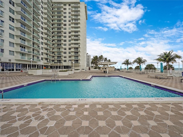 community pool featuring a patio area