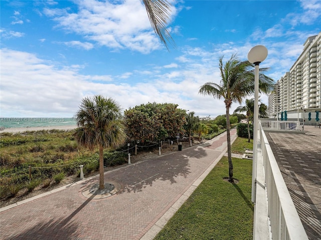 view of property's community featuring a view of the beach and a water view