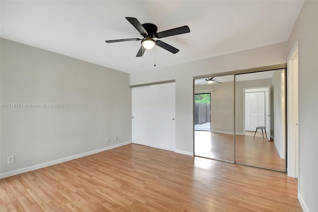 unfurnished bedroom with ceiling fan and light hardwood / wood-style flooring