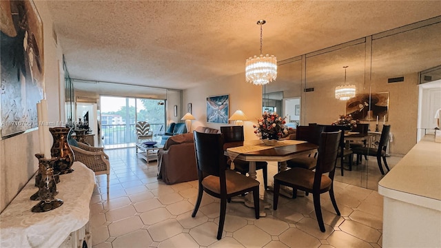 dining space with a chandelier and a textured ceiling