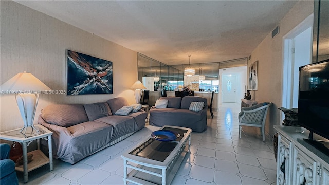 living room featuring a textured ceiling