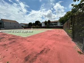 view of yard featuring tennis court