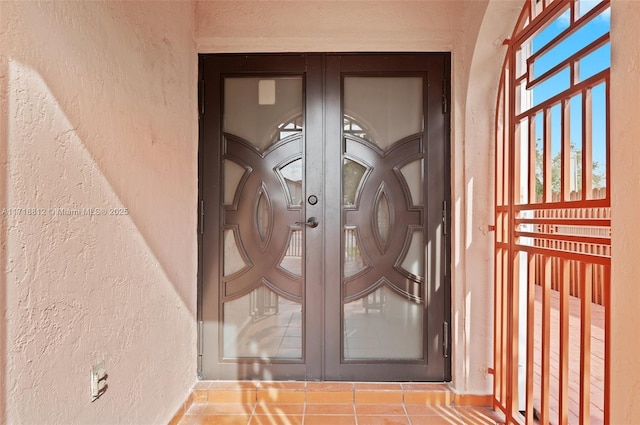 property entrance featuring french doors