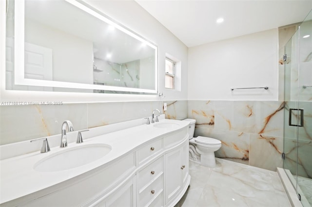 bathroom with walk in shower, vanity, toilet, and tile walls