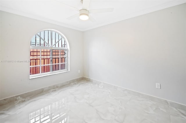 spare room with ceiling fan and ornamental molding