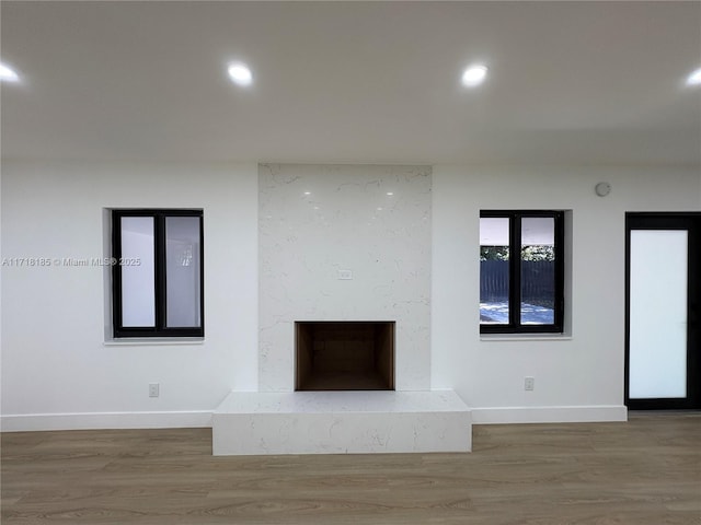 unfurnished living room with hardwood / wood-style flooring