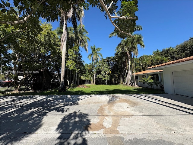 view of yard featuring a garage