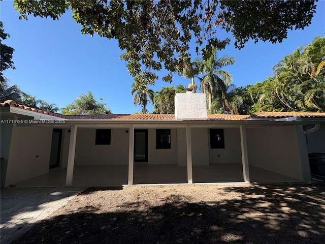 rear view of house with a patio