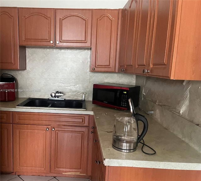 kitchen with tasteful backsplash and sink