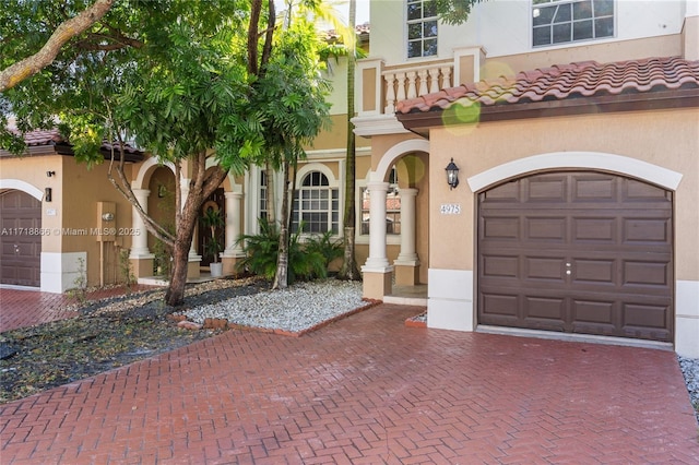 mediterranean / spanish-style house with a balcony