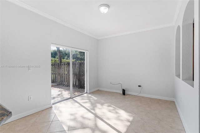 tiled empty room featuring ornamental molding