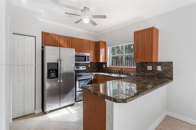 kitchen featuring backsplash, sink, light tile patterned floors, kitchen peninsula, and stainless steel appliances