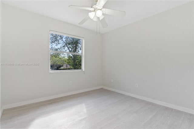 spare room featuring light hardwood / wood-style floors and ceiling fan