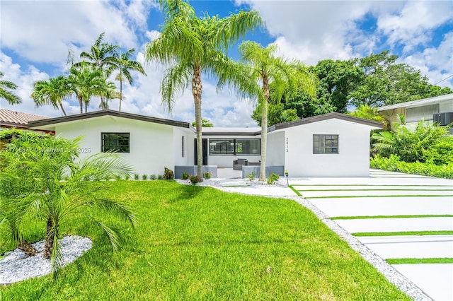 view of front of home with a front lawn