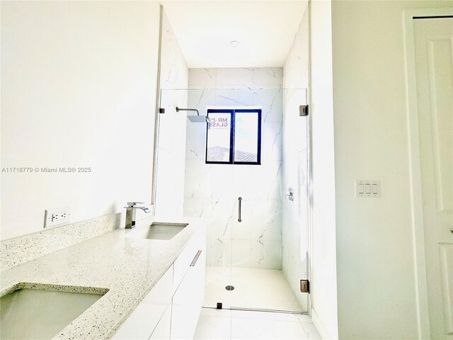 bathroom with vanity, tile patterned floors, and a shower with door