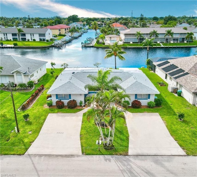 aerial view featuring a water view and a residential view