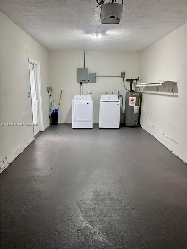 garage with independent washer and dryer, electric water heater, electric panel, and a garage door opener