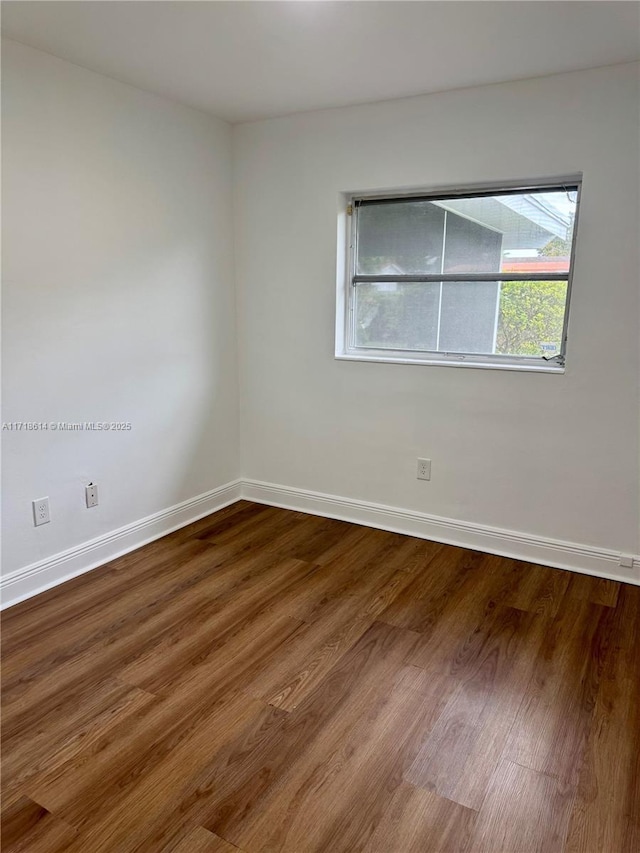 empty room featuring hardwood / wood-style floors