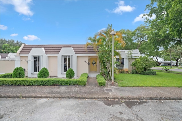 view of front of home with a front yard