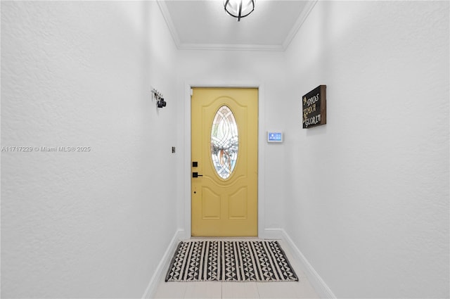 entryway with crown molding and tile patterned flooring