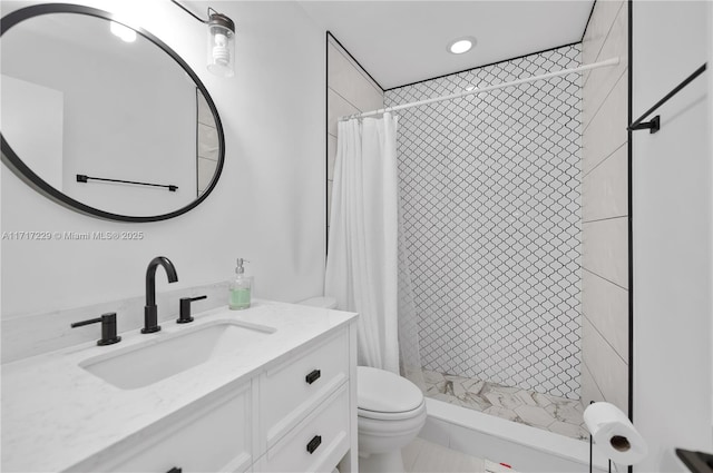 bathroom featuring vanity, toilet, and walk in shower