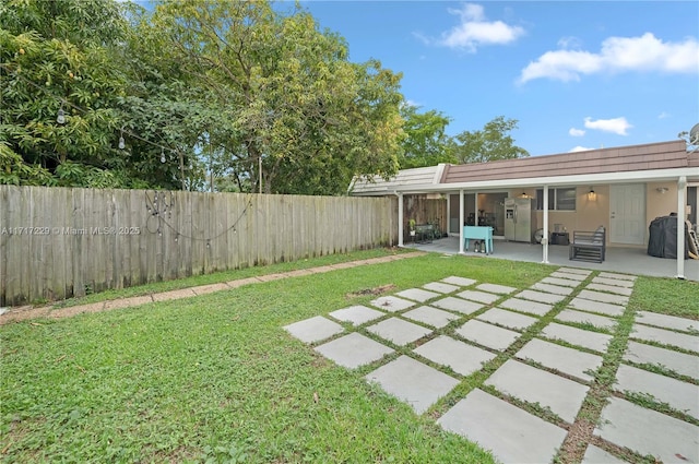 view of yard with a patio area