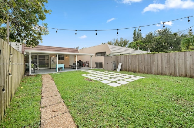 view of yard with a patio area, cooling unit, and an outdoor hangout area