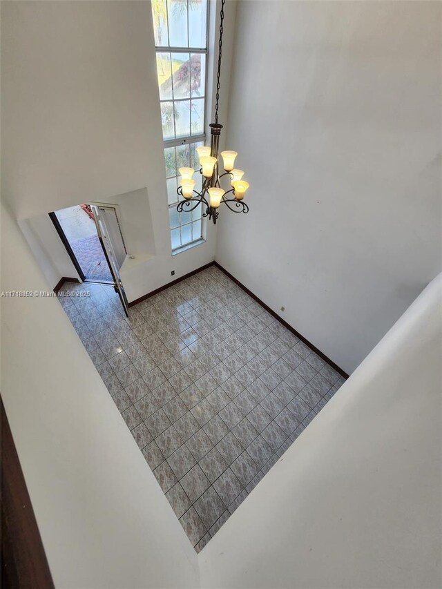 entryway featuring a chandelier