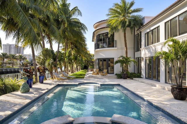 view of pool featuring a patio area