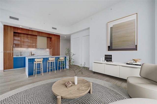 living room with light hardwood / wood-style flooring