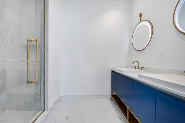 bathroom with vanity and a shower with shower door