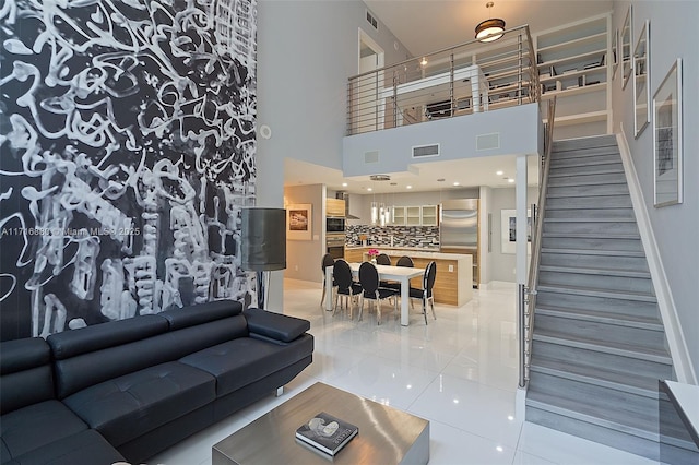 tiled living room with a high ceiling