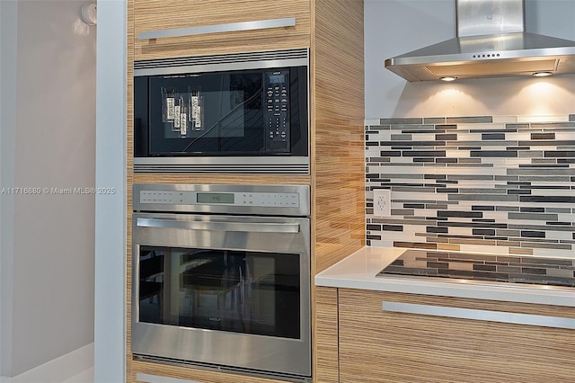 kitchen featuring extractor fan, backsplash, and stainless steel appliances