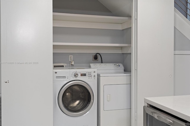 laundry room featuring washer and clothes dryer