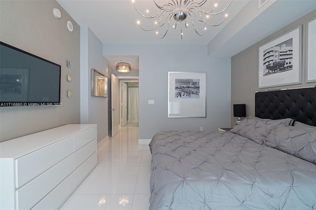 bedroom featuring light tile patterned flooring and a notable chandelier