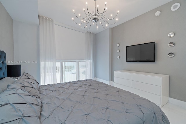 bedroom featuring an inviting chandelier