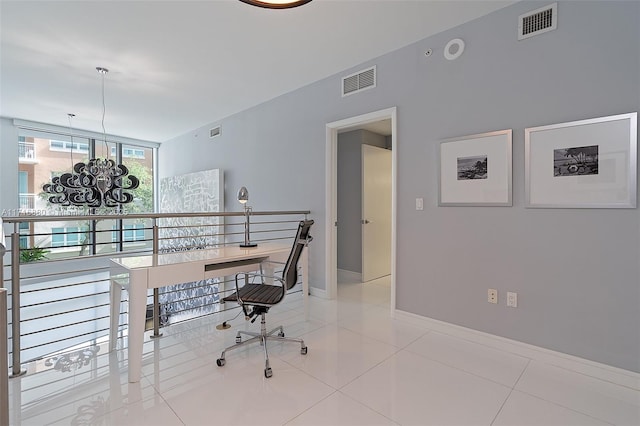 office featuring light tile patterned floors, a wall of windows, and a chandelier