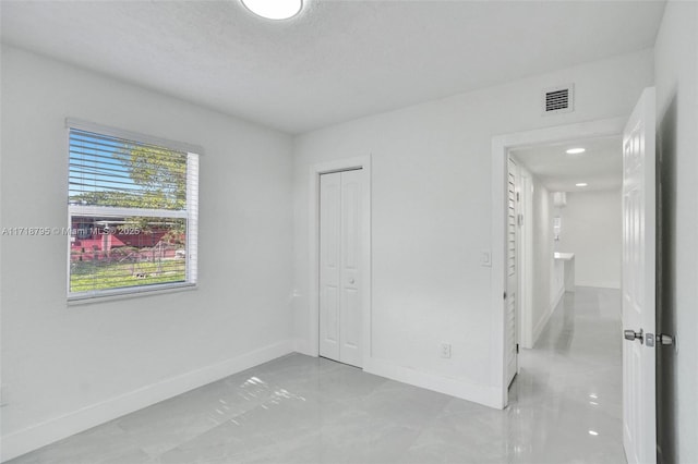 unfurnished bedroom with a closet