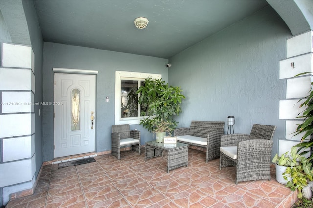 doorway to property featuring a patio area