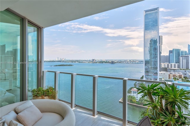 balcony featuring a water view