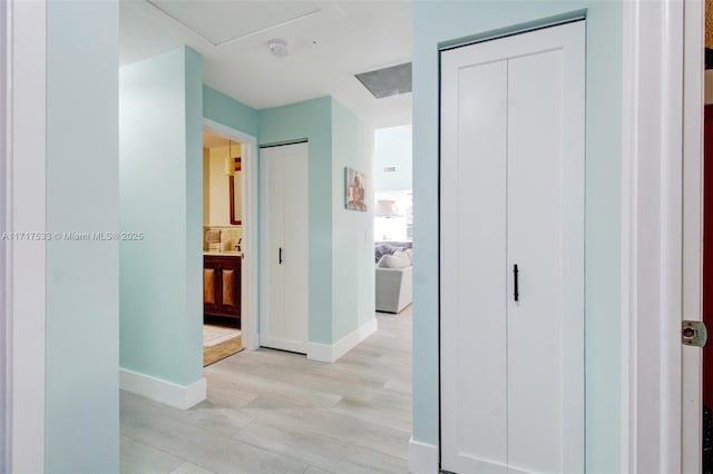 corridor featuring light hardwood / wood-style floors