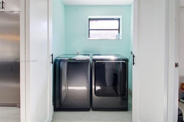 laundry area with washing machine and dryer