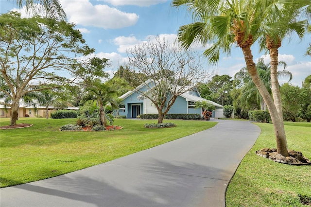 view of front of property with driveway and a front yard
